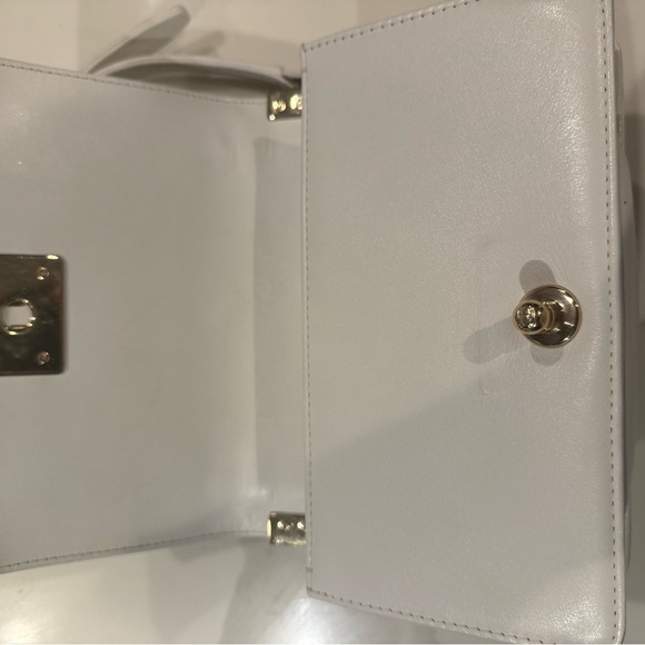 CHANEL White Quilted Crossbody with Chain Strap
Mini boy bag